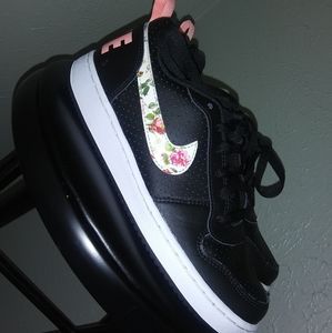 Size 5.5 youth black Nike with floral nike swoosh